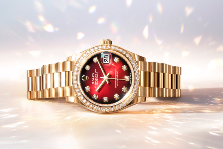 Rolex Datejust watch with red face on a festive background